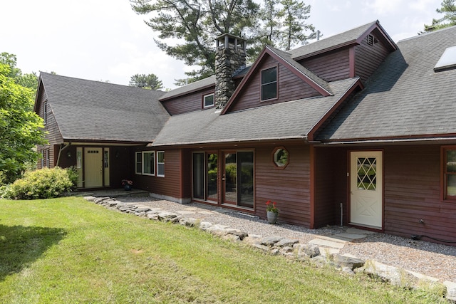 11 Everett Dow Dr, Woolwich, ME 04579 - view of front facade with a front yard, a chimney, and roof with shingles