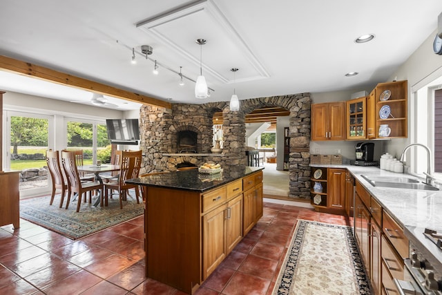 11 Everett Dow Dr, Woolwich, ME 04579 - kitchen featuring open shelves, brown cabinetry, dark stone countertops, dark tile patterned flooring, and recessed lighting