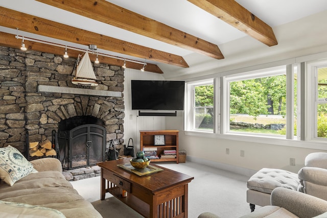 11 Everett Dow Dr, Woolwich, ME 04579 - living area with carpet, a fireplace, and beamed ceiling