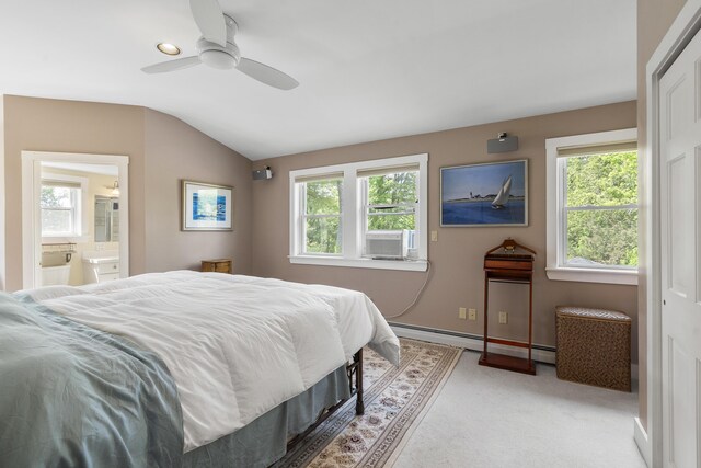 11 Everett Dow Dr, Woolwich, ME 04579 - bedroom with lofted ceiling, baseboard heating, light colored carpet, cooling unit, and ensuite bath