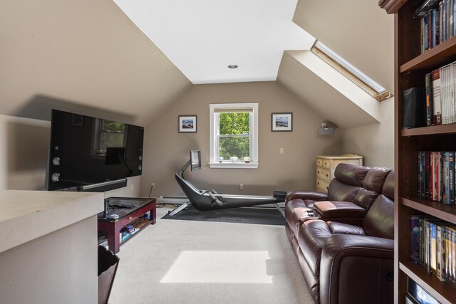 11 Everett Dow Dr, Woolwich, ME 04579 - living area with carpet, a baseboard heating unit, vaulted ceiling, and a skylight