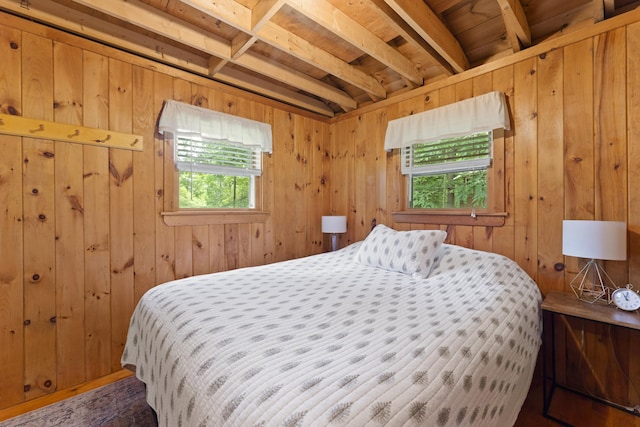 8 N Lakeview Dr, Litchfield, ME 04350 - bedroom featuring wooden walls and beam ceiling