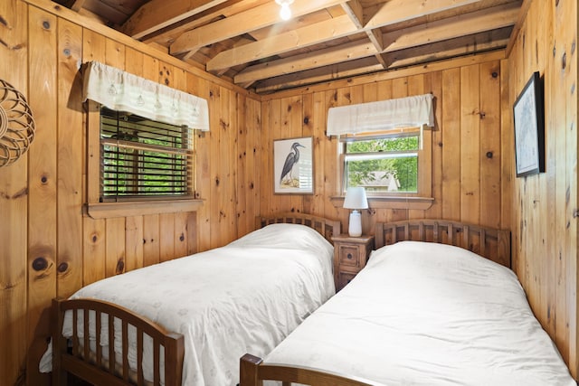 8 N Lakeview Dr, Litchfield, ME 04350 - bedroom featuring wood walls and beam ceiling