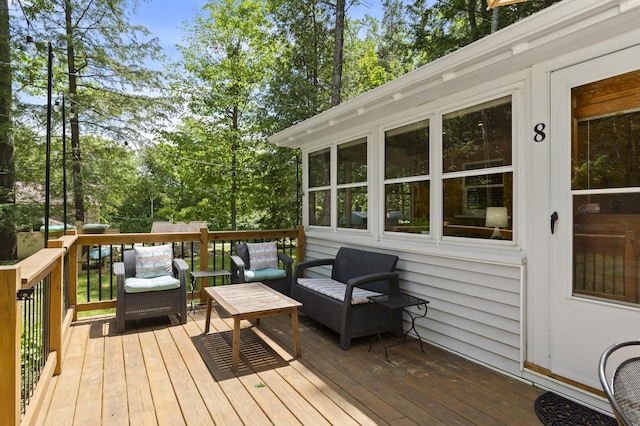 8 N Lakeview Dr, Litchfield, ME 04350 - wooden terrace with outdoor lounge area and view of scattered trees