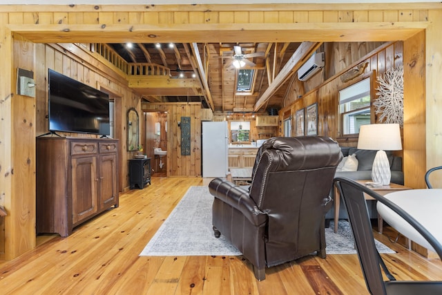 8 N Lakeview Dr, Litchfield, ME 04350 - living area with wood walls, a wall unit AC, a ceiling fan, light wood-style floors, and a wood ceiling with exposed beams