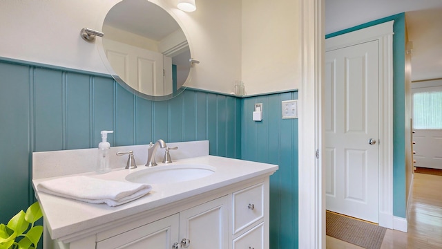 1 Daniels Way, Falmouth, ME 04105 - bathroom featuring vanity, a decorative wall, and wainscoting