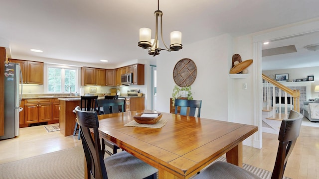 1 Daniels Way, Falmouth, ME 04105 - dining area with light wood-style flooring, recessed lighting, and a chandelier
