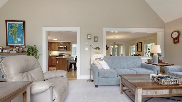 1 Daniels Way, Falmouth, ME 04105 - living room featuring high vaulted ceiling, healthy amount of natural light, light colored carpet, and a chandelier