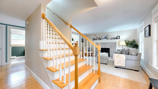 1 Daniels Way, Falmouth, ME 04105 - stairway with wood-type flooring and a fireplace