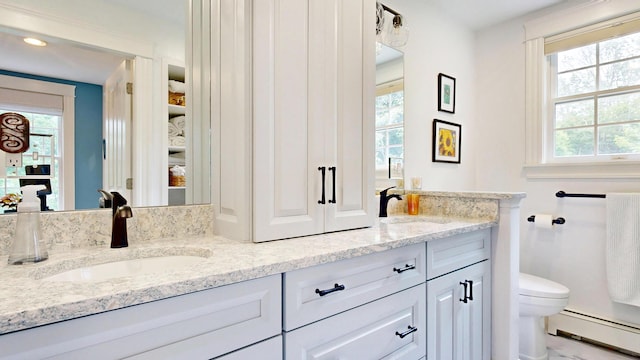 1 Daniels Way, Falmouth, ME 04105 - full bath featuring a baseboard heating unit, double vanity, and plenty of natural light