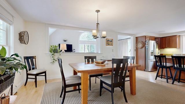 1 Daniels Way, Falmouth, ME 04105 - dining space featuring a chandelier and light wood-style flooring