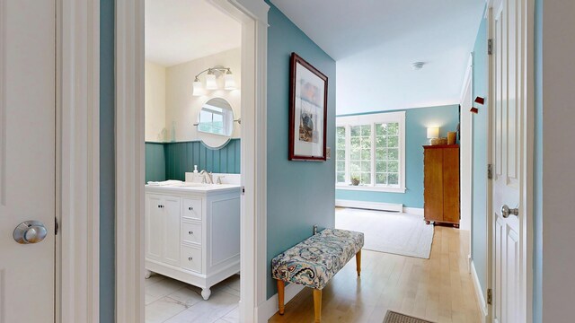 1 Daniels Way, Falmouth, ME 04105 - bathroom with a baseboard heating unit, vanity, and plenty of natural light