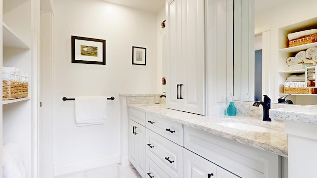 1 Daniels Way, Falmouth, ME 04105 - bathroom featuring double vanity and marble look tile flooring