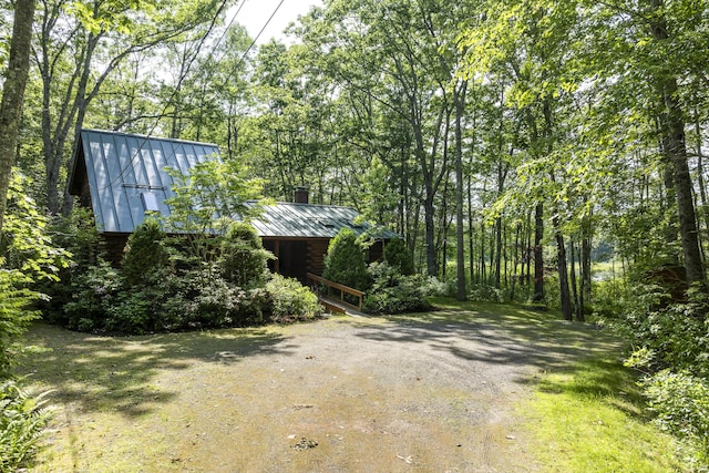 19 Fox Ln, Bremen, ME 04551 - view of yard featuring driveway and a wooded view