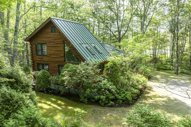 19 Fox Ln, Bremen, ME 04551 - view of side of property with a standing seam roof, a metal roof, and log exterior