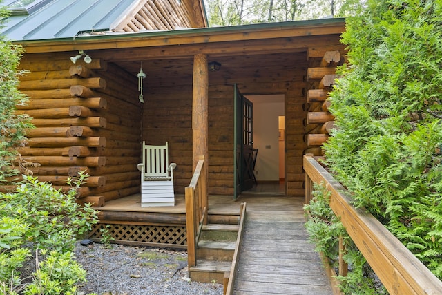 19 Fox Ln, Bremen, ME 04551 - property entrance with log exterior, a standing seam roof, and a metal roof