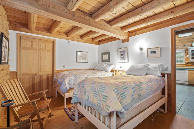 19 Fox Ln, Bremen, ME 04551 - bedroom featuring a wood ceiling with exposed beams, wainscoting, and light wood finished floors