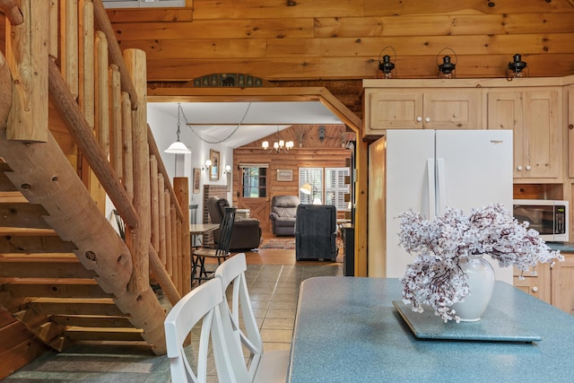 19 Fox Ln, Bremen, ME 04551 - dining room featuring stairs, rustic walls, and a chandelier