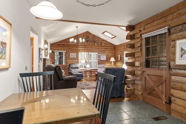 19 Fox Ln, Bremen, ME 04551 - dining space with rustic walls, a chandelier, and lofted ceiling