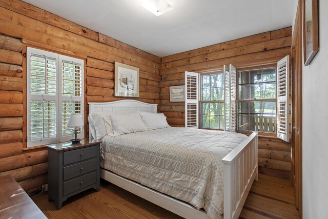 19 Fox Ln, Bremen, ME 04551 - bedroom with rustic walls and wood-type flooring