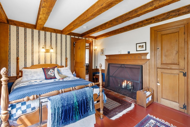 351 Mill Creek Rd, Islesboro, ME 04848 - bedroom featuring a fireplace with flush hearth, wood finished floors, and beamed ceiling
