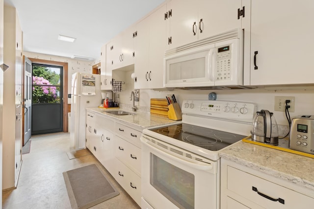 351 Mill Creek Rd, Islesboro, ME 04848 - kitchen featuring white appliances, white cabinets, and light stone countertops