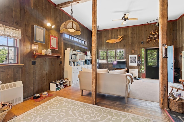 351 Mill Creek Rd, Islesboro, ME 04848 - living area with wooden walls, radiator heating unit, ceiling fan, and wood-type flooring