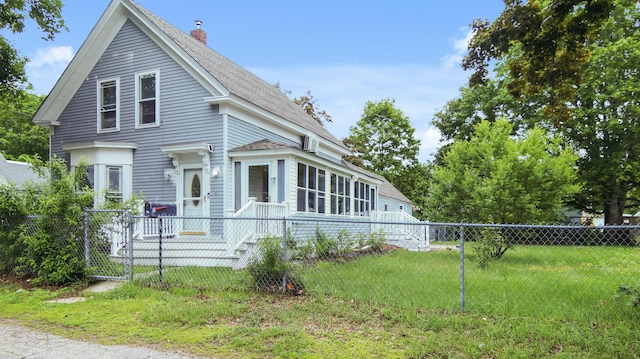 15 Goodwin St, Sanford, ME 04083 - view of front of property featuring roof with shingles and a chimney