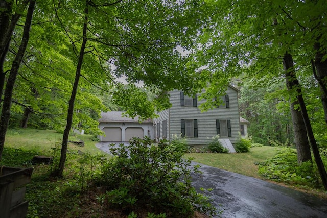 3 Fenderson Hill N, Wilton, ME 04294 - view of front facade with driveway, a garage, and a front yard