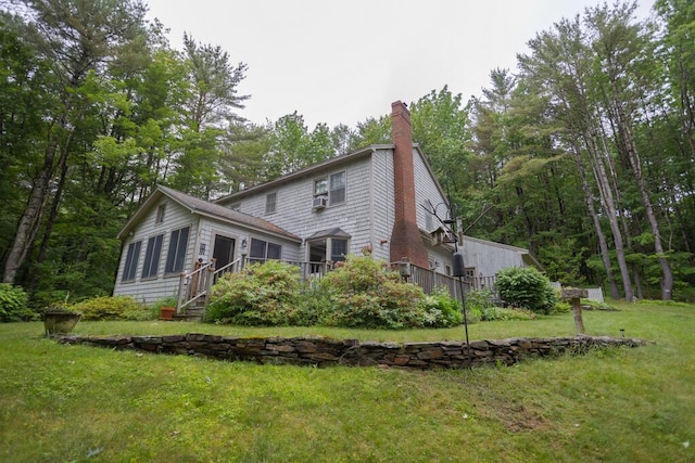3 Fenderson Hill N, Wilton, ME 04294 - back of property featuring a chimney, a yard, and a deck