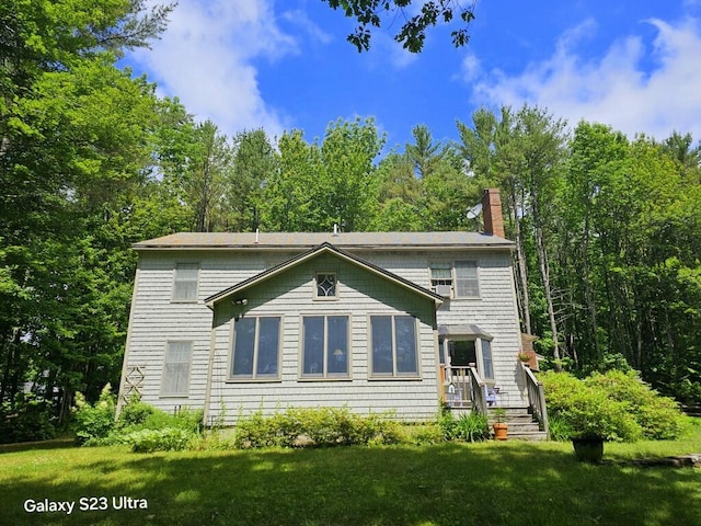 3 Fenderson Hill N, Wilton, ME 04294 - back of house featuring a chimney and a lawn