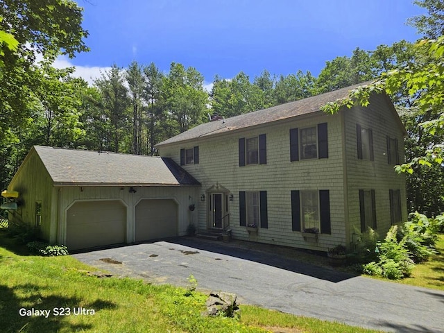 3 Fenderson Hill N, Wilton, ME 04294 - colonial-style house featuring a garage, driveway, entry steps, and a shingled roof