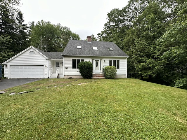53 Pennacook Cir, Wells, ME 04090 - new england style home featuring asphalt driveway, a chimney, an attached garage, a front yard, and roof with shingles