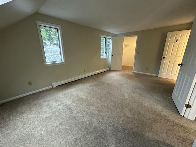 53 Pennacook Cir, Wells, ME 04090 - unfurnished bedroom with a baseboard radiator, carpet, multiple windows, and lofted ceiling