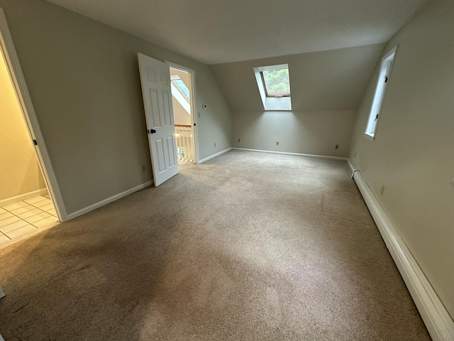 53 Pennacook Cir, Wells, ME 04090 - bonus room featuring a skylight, light carpet, baseboard heating, and vaulted ceiling