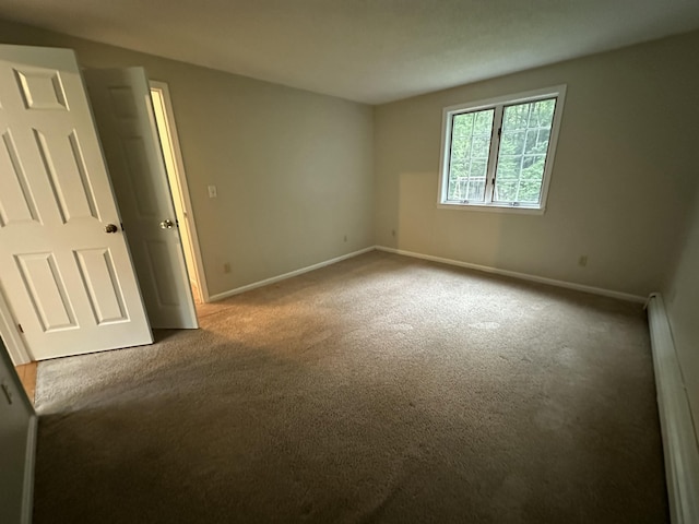 53 Pennacook Cir, Wells, ME 04090 - carpeted spare room featuring a baseboard radiator and baseboards