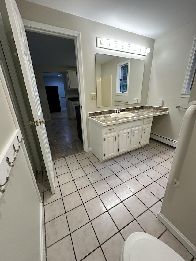 53 Pennacook Cir, Wells, ME 04090 - bathroom with a baseboard heating unit, vanity, and tile patterned floors