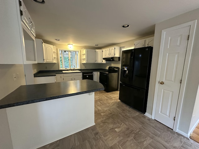 53 Pennacook Cir, Wells, ME 04090 - kitchen featuring black appliances, a peninsula, dark countertops, white cabinetry, and under cabinet range hood