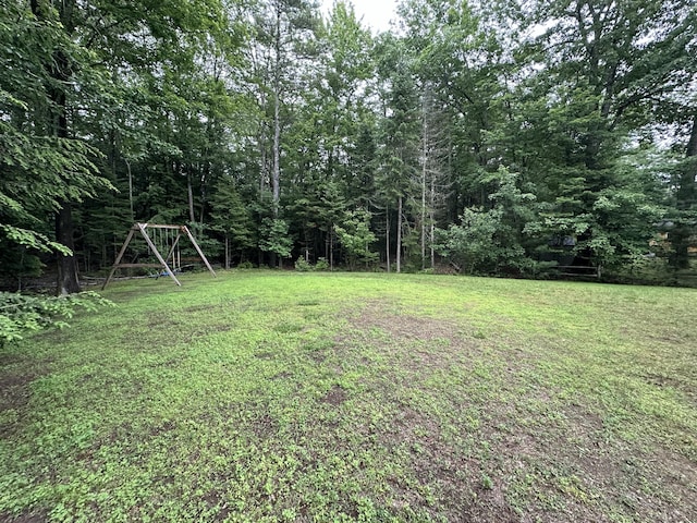53 Pennacook Cir, Wells, ME 04090 - view of green lawn featuring a forest view