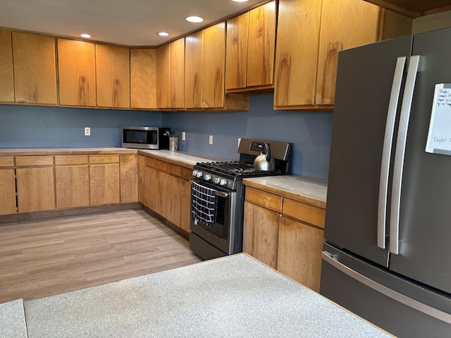 440 Temple Rd, Wilton, ME 04294 - kitchen featuring appliances with stainless steel finishes, light countertops, recessed lighting, and brown cabinets