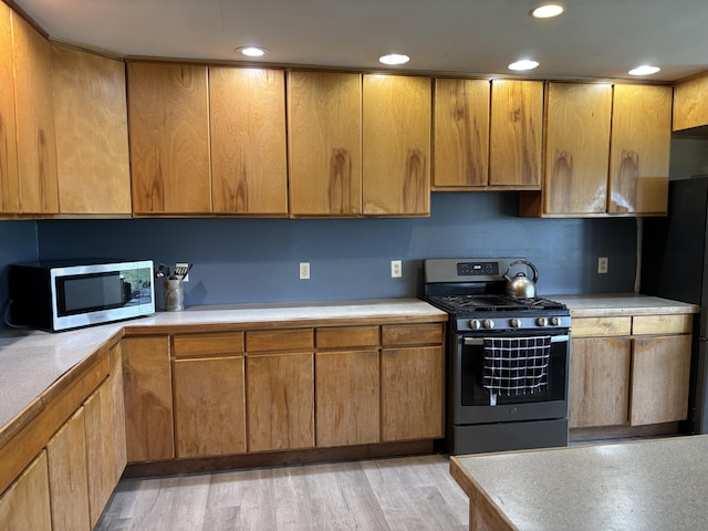 440 Temple Rd, Wilton, ME 04294 - kitchen featuring stainless steel appliances, light countertops, recessed lighting, and light wood finished floors