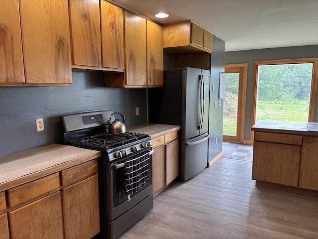 440 Temple Rd, Wilton, ME 04294 - kitchen with stainless steel appliances, light wood-type flooring, light countertops, brown cabinets, and recessed lighting