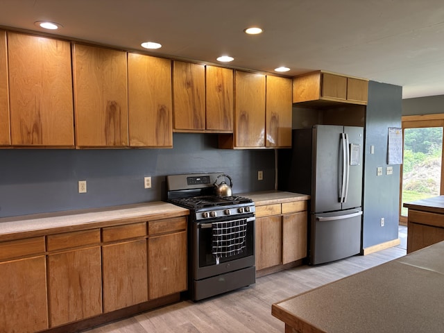 440 Temple Rd, Wilton, ME 04294 - kitchen featuring stainless steel appliances, light wood-style flooring, light countertops, recessed lighting, and brown cabinetry