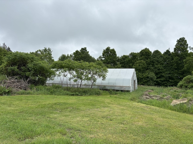 440 Temple Rd, Wilton, ME 04294 - view of grassy yard featuring an exterior structure and an outbuilding