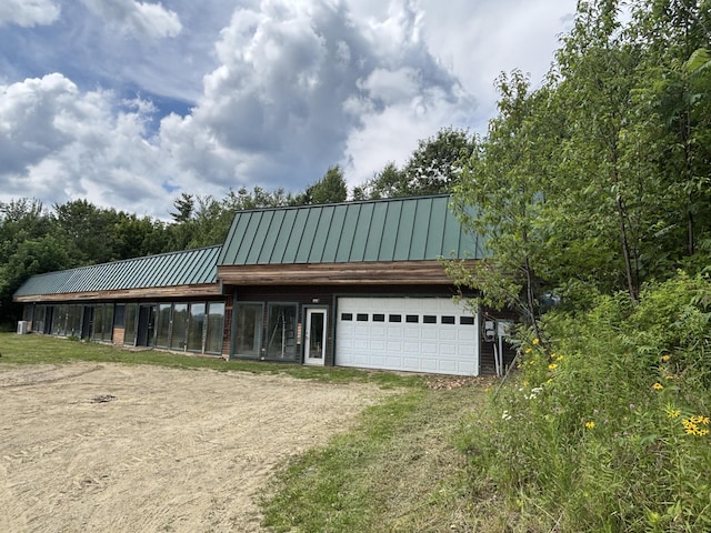 440 Temple Rd, Wilton, ME 04294 - garage featuring dirt driveway