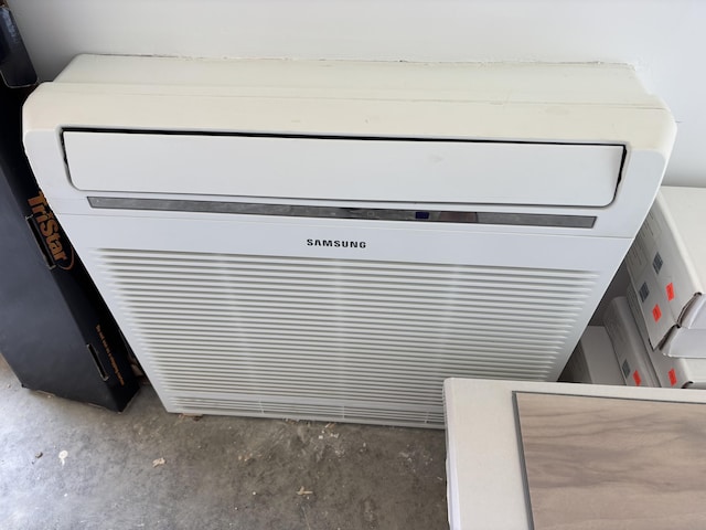 440 Temple Rd, Wilton, ME 04294 - detailed view of an AC wall unit and concrete floors