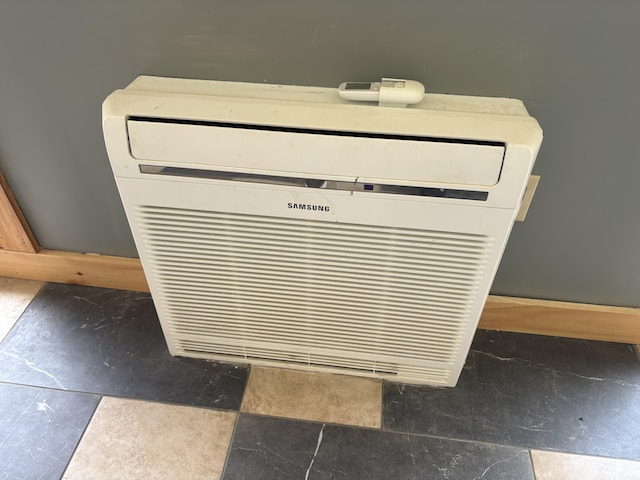 440 Temple Rd, Wilton, ME 04294 - detailed view of an AC wall unit and baseboards