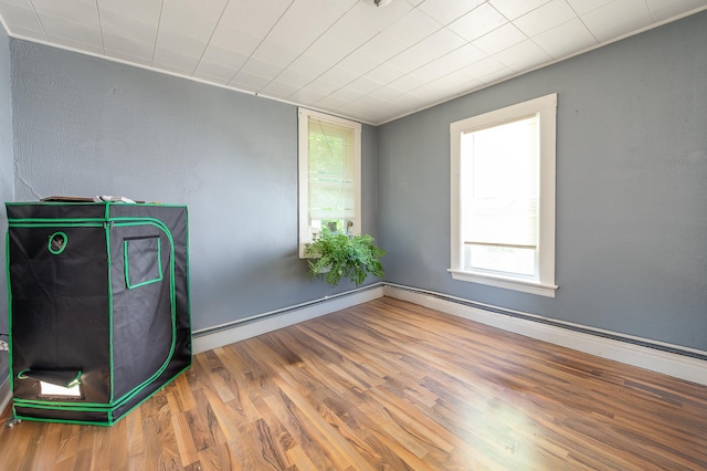 323 Cumberland St, Rumford, ME 04276 - spare room with healthy amount of natural light and wood finished floors