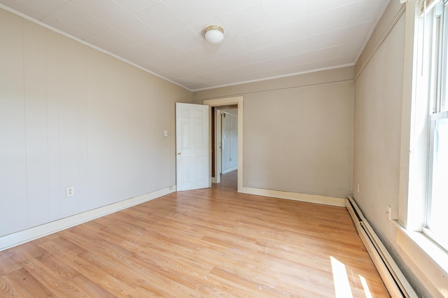 323 Cumberland St, Rumford, ME 04276 - empty room with a baseboard radiator, crown molding, and light wood-style floors