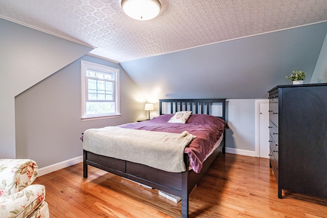 51 Burwell Ave, South Portland, ME 04106 - bedroom featuring an ornate ceiling, light wood-style flooring, and vaulted ceiling